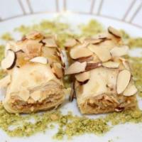 Almond Caramel Baklava · Thin layers of fillo dough folded and filled with crushed premium almonds and cashews baked ...
