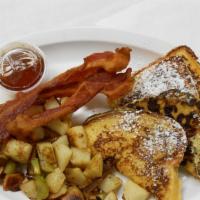 Challah French Toast · Thick-cut, house-made challah. Served with bacon or sausage and your choice of side.