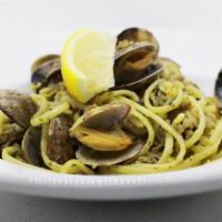 Clams Linguini · Linguini with clams, served in a white wine and garlic sauce.