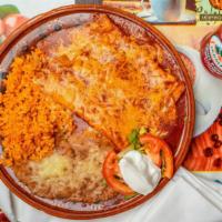 Enchiladas Plate · 2 pieces. Choice of meat, chicken, or beef, sour cream, rice and beans.