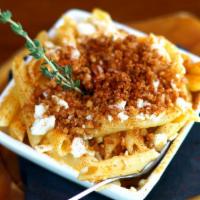 Fiery Feta Mac’ N Cheese · Penne pasta, kasseri, cheddar, firey feta, and pita crumbs.