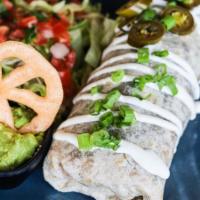 Grilled Chicken Burrito · large flour tortilla stuffed with cheese, refried black beans & mexican rice, topped with so...