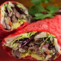 Skinny Grilled Chicken Burrito Wrap · red flour tortilla stuffed with Citrusy Pom salad, salsa fresca, cotixa cheese, crunchy frie...
