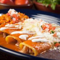 Fish Lazy Enchilada · corn tortillas folded over cheese, filling, red or green sauce, more cheese, crema, cotixa, ...