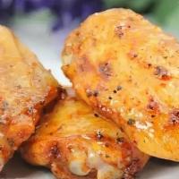 椒盐鸡翅 / Chicken Wings With Salt & Pepper · Cooked wing of a chicken coated in sauce or seasoning.