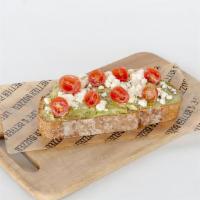 Feta-Avocado Toast · Multigrain Bread Toasted with Butter and Avocado.  Topped with Feta Cheese and Cherry Tomato