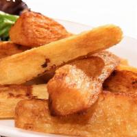 Yucas Fritas · Fried yucca served with creamy huancaina sauce (blended with cheese, mix and saltine cracker...