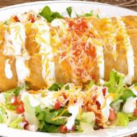 Chimichanga · Fried flour tortilla, choice of meat, rice, beans, topped with sour cream, lettuce, cheese, ...