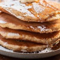 Flapjack Pancakes · 4 griddle buttermilk pancakes with syrup, butter and powdered sugar with your choice of pres...