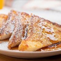 French Toast · brioche dipped in our french toast batter, griddled until golden brown. Served with syrup, b...