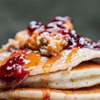 Pb+J  Pancakes · 4 griddled buttermilk pancakes, smothered with chunky peanut butter and grape jelly, maple s...