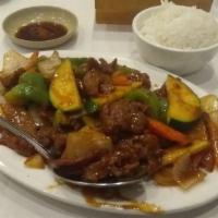 Hunan Beef · Hot and spicy. Stir fried beef with bell peppers, zucchini, carrots, and onions with black b...