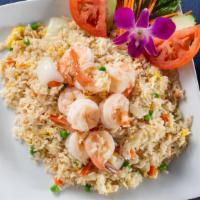 Thai Fried Rice · Stir fried rice with egg, pea, carrot and onion.