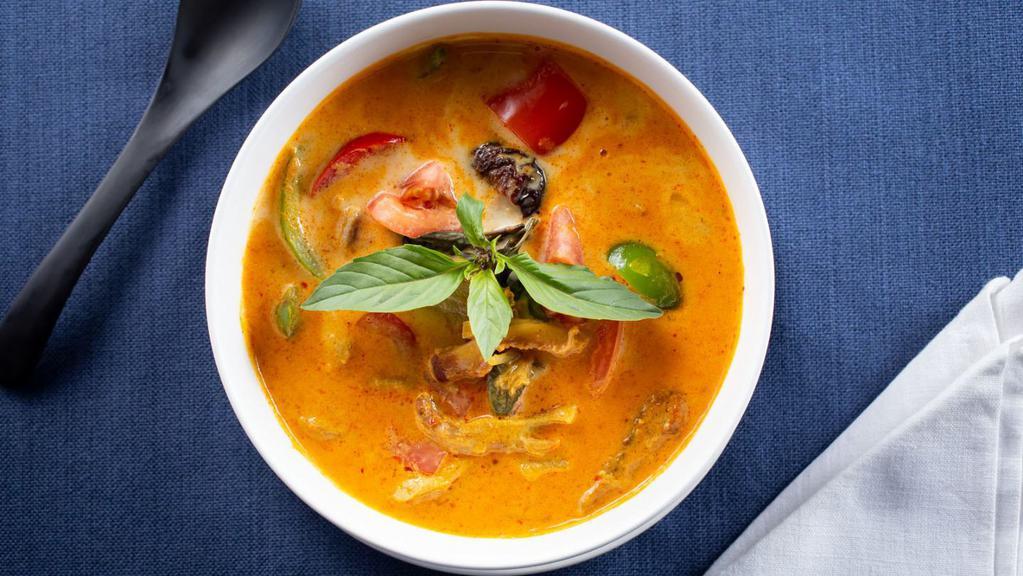 Duck Curry · Roasted Duck, coconut milk, tomato, pineapple, bell pepper and sweet Thai basil in red curry sauce.