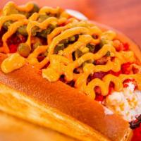 Fired Up Dogs · Pickled jalapenos, hot Cheetos, garlic butter Cajun sauce, bacon bits, creamy corn