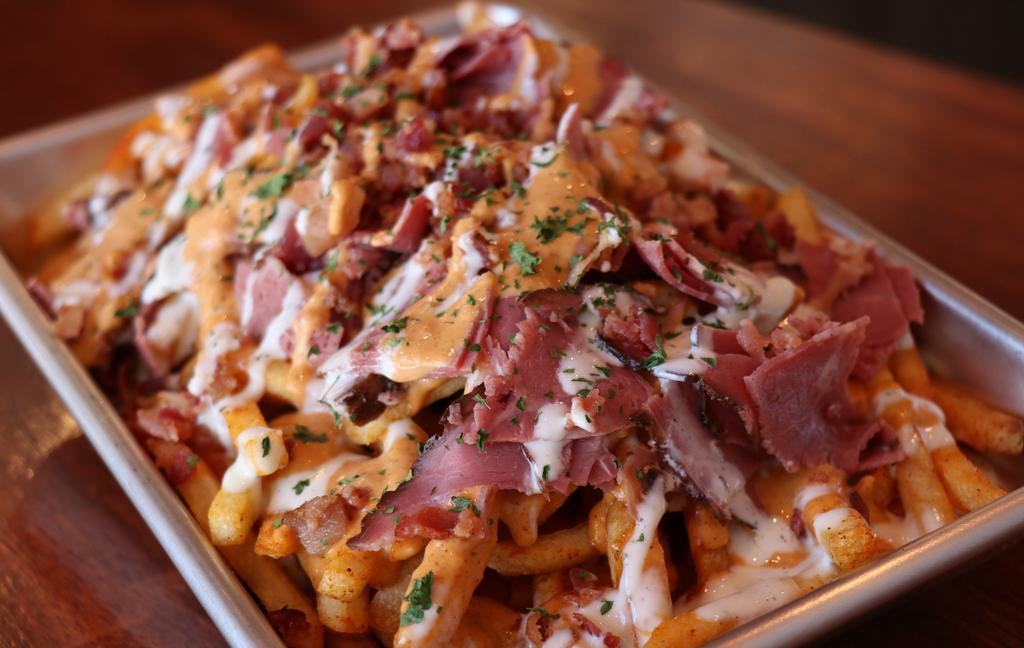 Bacon & Pastrami Fries · SHOESTRING FRIES,  5 PIECE CHICKEN ,
D.C SAUCE, RANCH SAUCE, BACON & PASTRAMI 
CHEDDAR CHEESE,PARSLEY