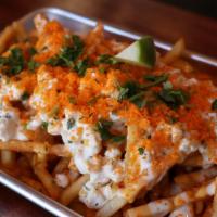 Elote Cheetos Fries · SHOESTRING FRIES, 5 PIECE CHICKEN,
D.C SAUCE, RANCH SAUCE ,CREAMY CORN, COJITA CHEESE, CHEES...