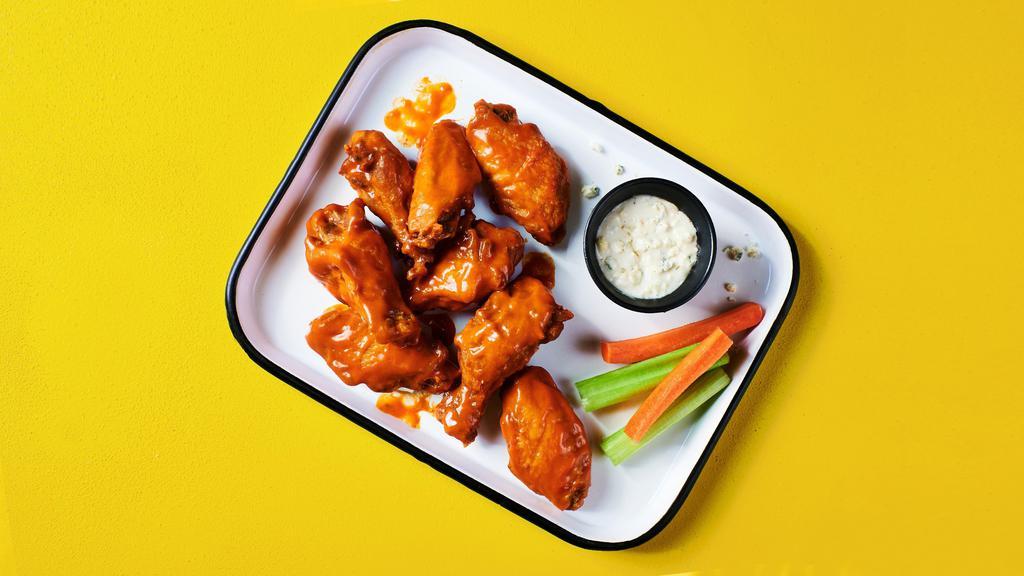 Bigger Better Buffalo Wings · Big, juicy, meaty, tender and saucy buffalo wings, served with your choice of ranch or blue cheese, and crunchy celery and carrots for dipping