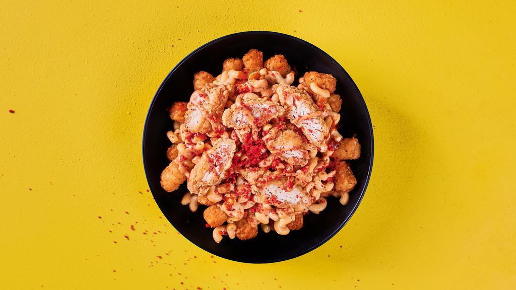 Fully Packed Bowl · Bed of perfectly crispy, seasoned potato tots, layered with Mac & Yellow, fried chicken nuggs, drizzled with Spicy Buffalo Sauce, Thrill Sauce and sprinkled with Hot Cheetos dust