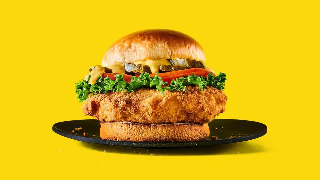Og Fried Chicken Sandwich · Crispy battered fried chicken topped with fresh lettuce, sliced tomato, bread & butter pickles, and honey mustard on a fat brioche bun