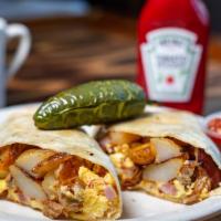 Breakfast Burrito · Ham, bacon, sausage and linguisa, country potatoes topped with jack and cheddar cheese, wrap...