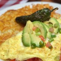 Mexicali Fiesta Omelette · This traditional omelette has diced tomatoes, and onions, with shredded jack cheese, avocado...
