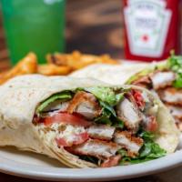 Crispy Chicken Wrap · Crispy chicken wrapped in a flour tortilla with green leaf tomato, jack cheese, avocado, bac...
