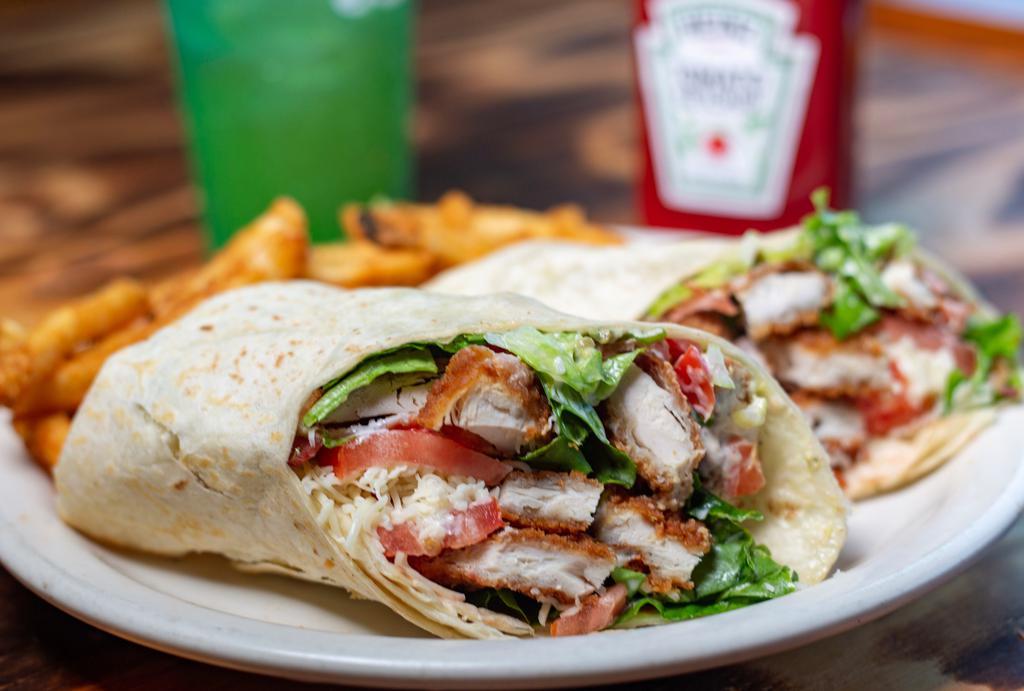 Crispy Chicken Wrap · Crispy chicken wrapped in a flour tortilla with green leaf tomato, jack cheese, avocado, bacon and ranch dressing.
