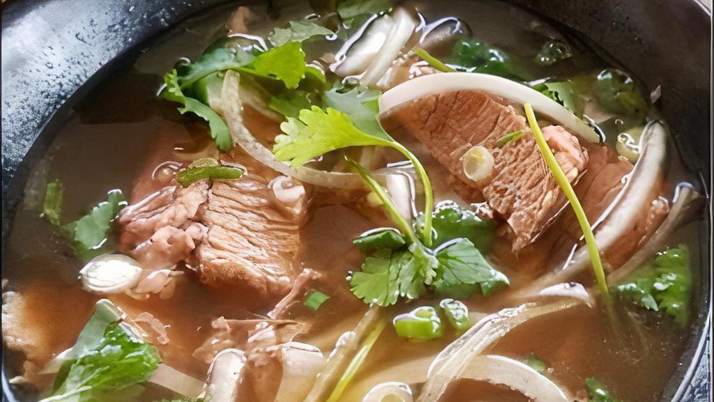 Brisket Pho Broth · 72 Hours Bone Broth Served with 8 Hours Slow-Cooked Angus Briskets, Gluten-Free Rice Noodles, Scallion, Onions, and Cilantro.
