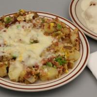 Train Wreck · Diced bacon, two scrambled eggs, bell peppers, onions, cottage potatoes and Jack cheese with...