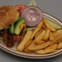 The California Burger · Fresh avocado, American cheese, two strips of bacon, lettuce, tomatoes, onions and pickles.