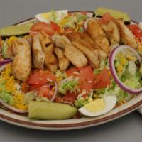 Grilled Chicken Salad · Tossed crisp greens topped with chunks of grilled chicken, hard-boiled eggs, tomatoes, onion...