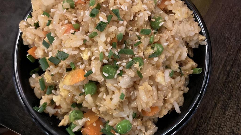 Fried Rice · Sesame and soy fried rice with carrots, peas, onions, and garlic