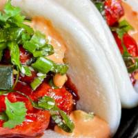 Korean Chicken Sliders · Three crispy chicken bao sliders, lettuce, chili sauce, pickled onion
