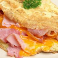 Ham & Cheese Omelette · Fresh cooked ham omelette served with toast, hash browns and jelly