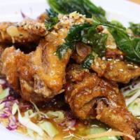 Mama Garlic Wing · Deep-fried chicken wings tossed in house garlic sauce.