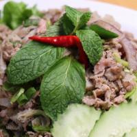Beef Larb · Minced meat with traditional spices and mints.