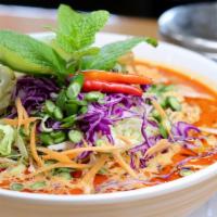 Kaon Poon · Soft round rice noodles in red curry with chicken, chicken feet & fresh vegetables.