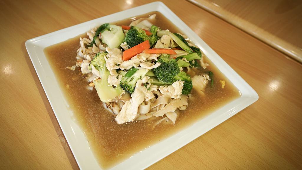 Rad Na · Flat wide rice noodles, Chinese broccoli & carrots topped w/ thick gravy.