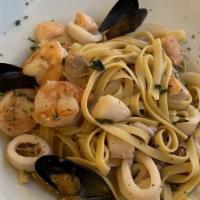 Fettuccine Pescatore · House Favorite. calamari, shrimp, scallops, salmon, mussels, Garlic, (red tomato or white wi...