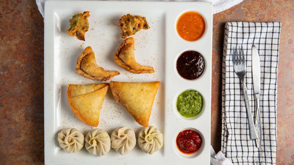 Himalayan Appetizer · Vegetarian. Vegetarian sampler platter including pakoras, samosas. Momos and naan bread. Serves 2-4 people.