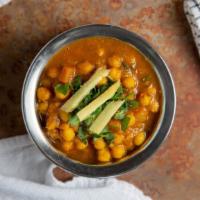 Chana Masala · Vegetarian. Garbanzo beans cooked with tomatoes, onion, herbs and spices.