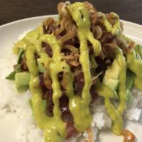 Poke Over Rice · Ahi tuna in soy ginger marinade, avocado, fried shallots, green onion, midori spicy sauce ov...