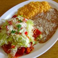 Enchiladas De Pollo · Incluye frijoles, arroz y tortillas. Three enchiladas.