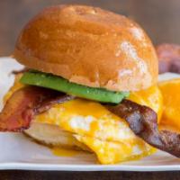 Breakfast Sandwich · 2 fried eggs and cheddar cheese on a toasted challah bun.