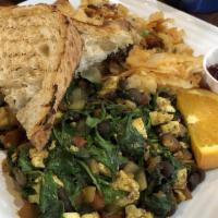Veggie Scramble · Mushrooms, spinach, onions, roasted red peppers and parmesan cheese. Served with potatoes an...