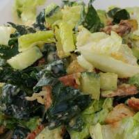 Vegan Kale Caesar · Tuscan kale, crisp romaine tossed with avocado, cucumber, house-made cashew 'parmesan