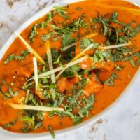 Chicken Tikka Masala · Chicken breast in tomato-onion creamy masala sauce flavored with fresh herbs and spices.