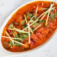  Butter Chicken · Shredded tandoori chicken in tomato creamy sauce and a touch of butter with herbs and spices.