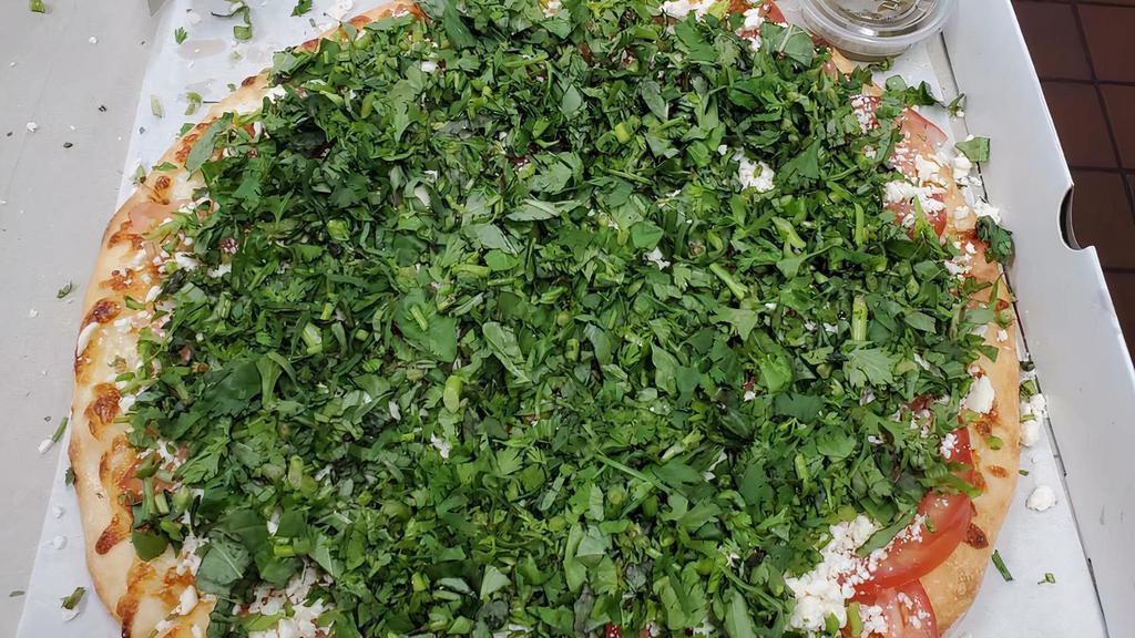 Armenian Pizza · Feta cheese, mozzarella, fresh cilantro, fresh basil, chopped tomatoes, thin crust.